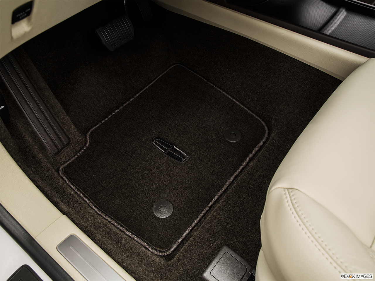 2015 Lincoln MKZ Base Driver's floor mat and pedals. Mid-seat level from outside looking in. 