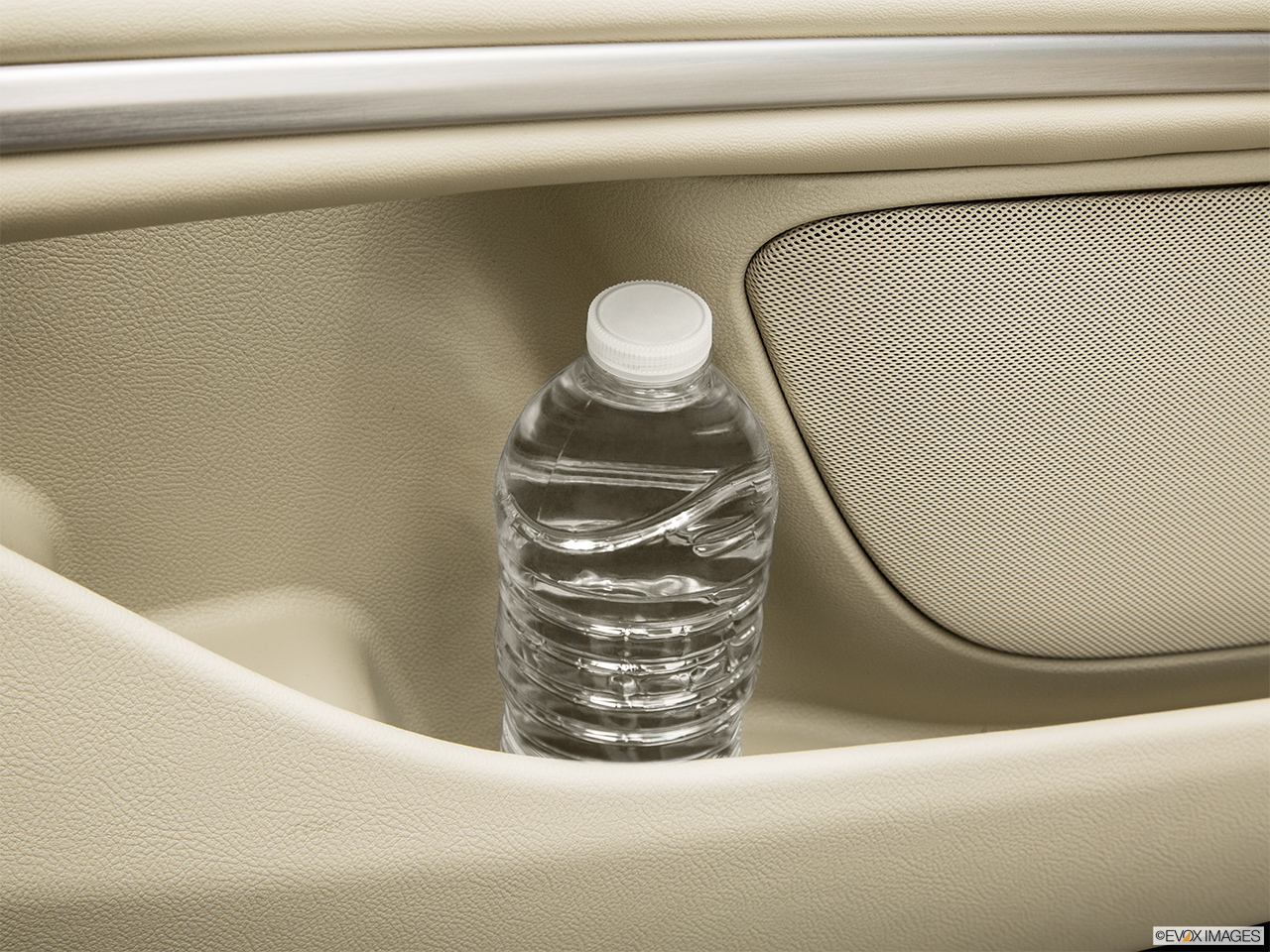 2015 Lincoln MKZ Base Second row side cup holder with coffee prop, or second row door cup holder with water bottle. 