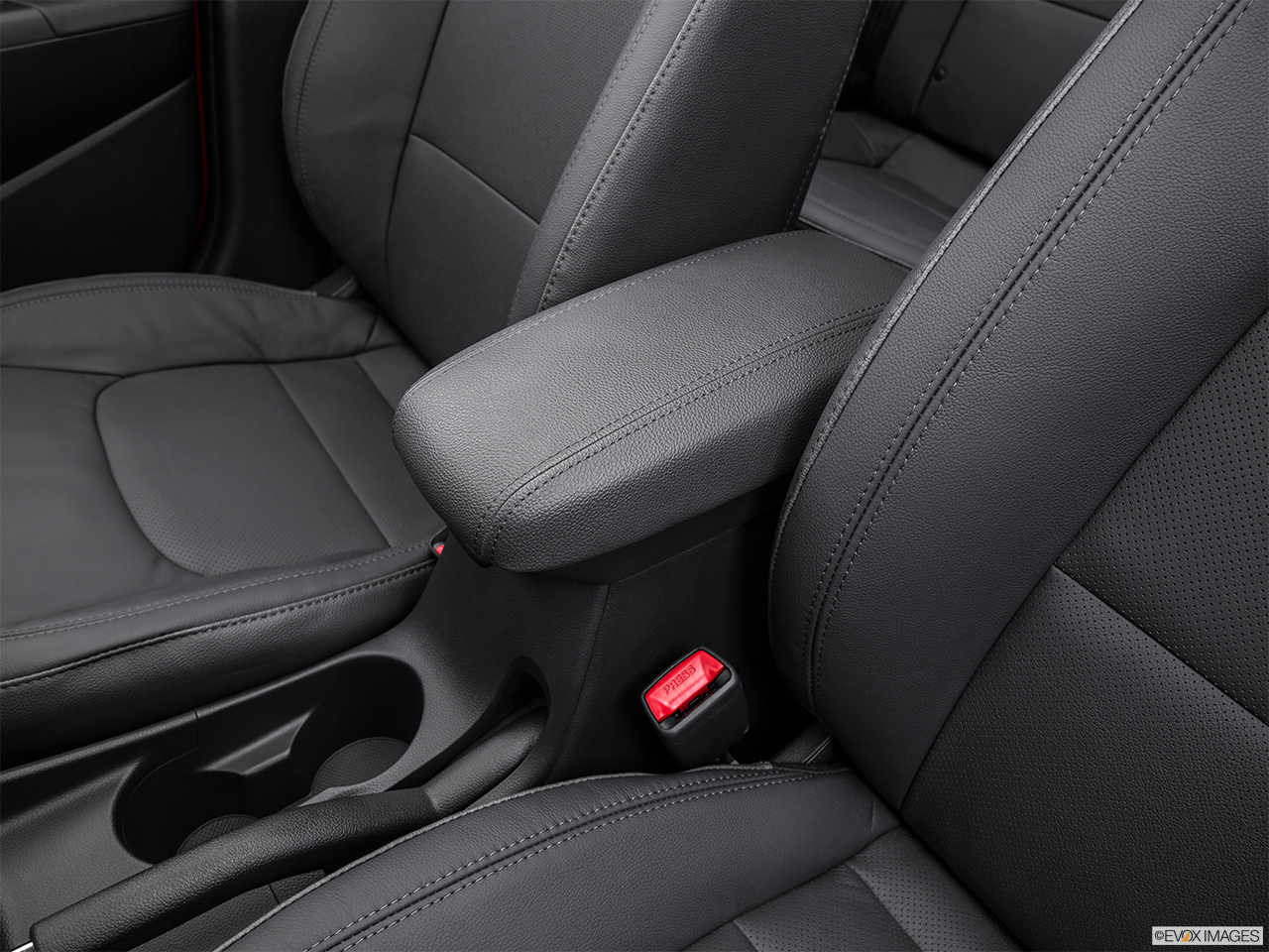 2015 Kia Rio 5-door SX Front center console with closed lid, from driver's side looking down 
