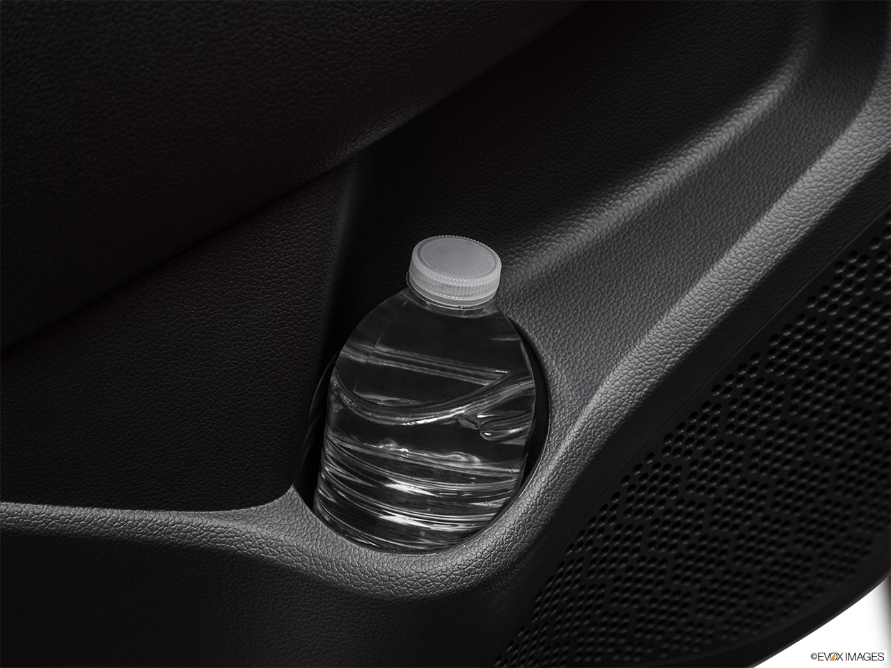 2015 Kia Rio 5-door SX Second row side cup holder with coffee prop, or second row door cup holder with water bottle. 