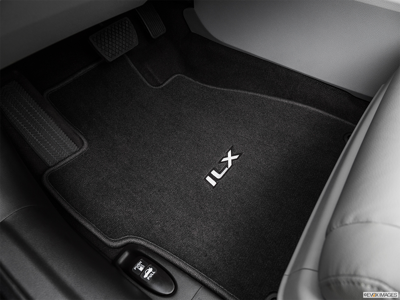 2016 Acura ILX Base Driver's floor mat and pedals. Mid-seat level from outside looking in. 