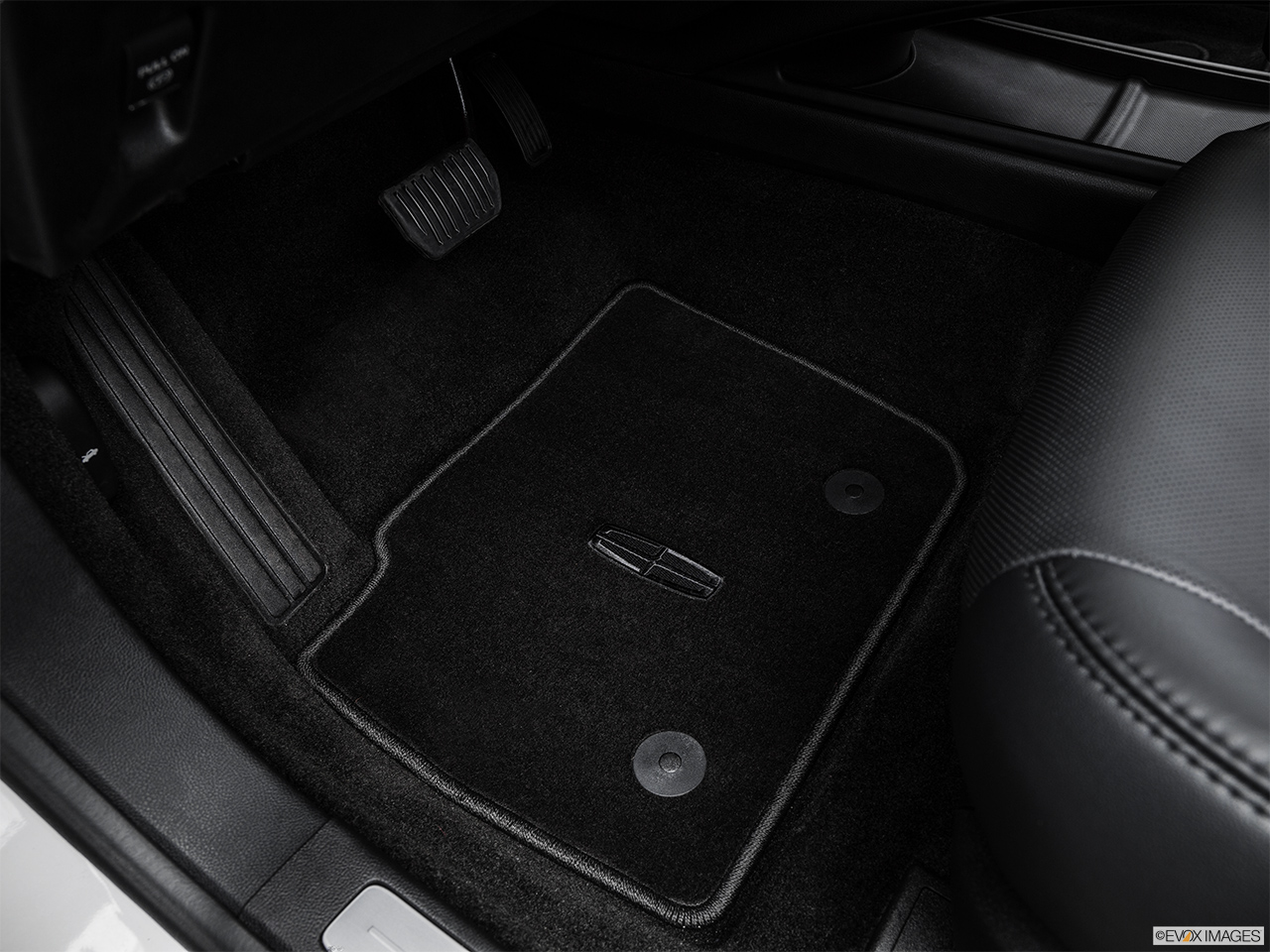 2016 Lincoln MKZ 2.0L EcoBoost FWD Driver's floor mat and pedals. Mid-seat level from outside looking in. 