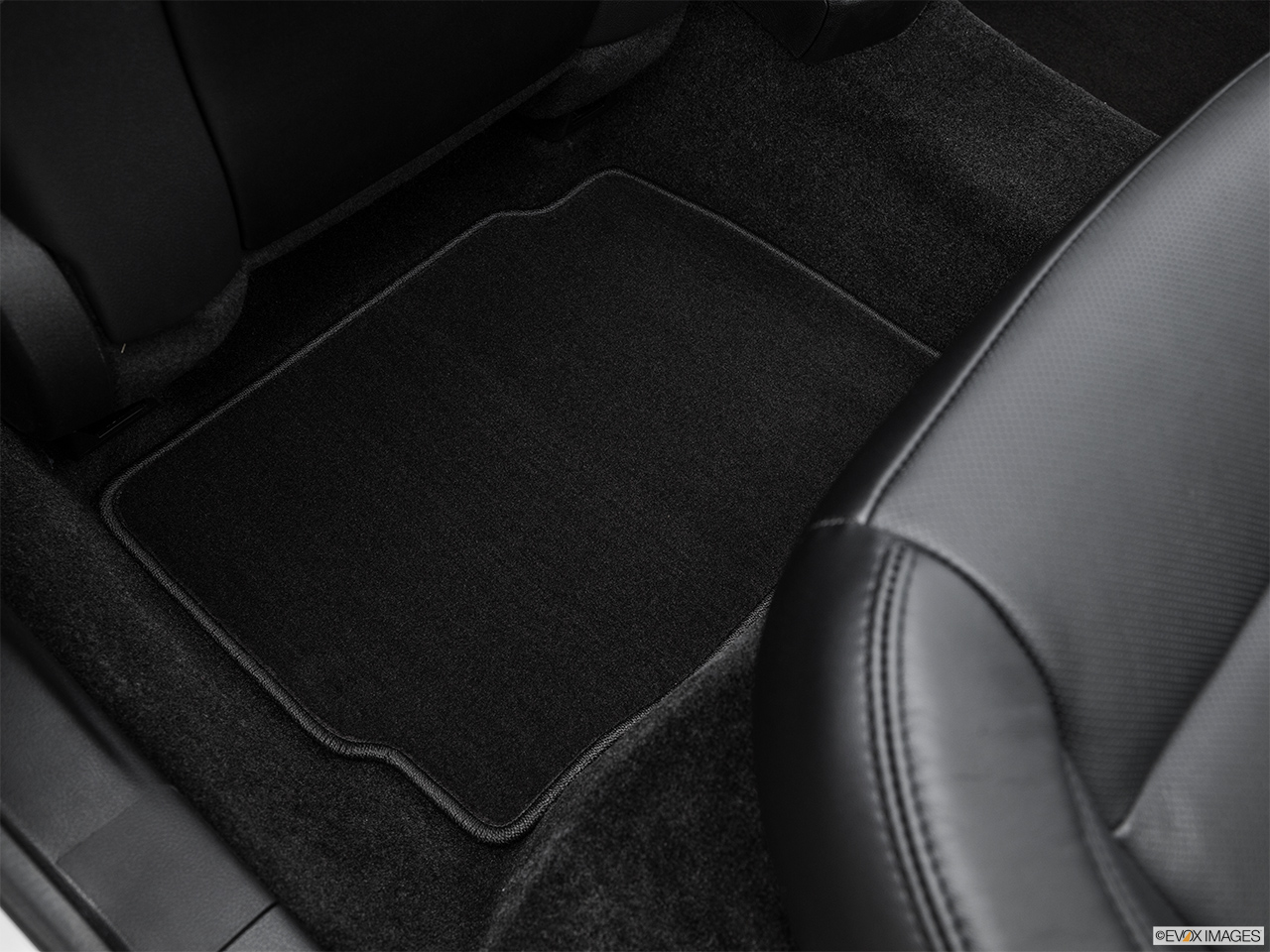 2016 Lincoln MKZ 2.0L EcoBoost FWD Rear driver's side floor mat. Mid-seat level from outside looking in. 