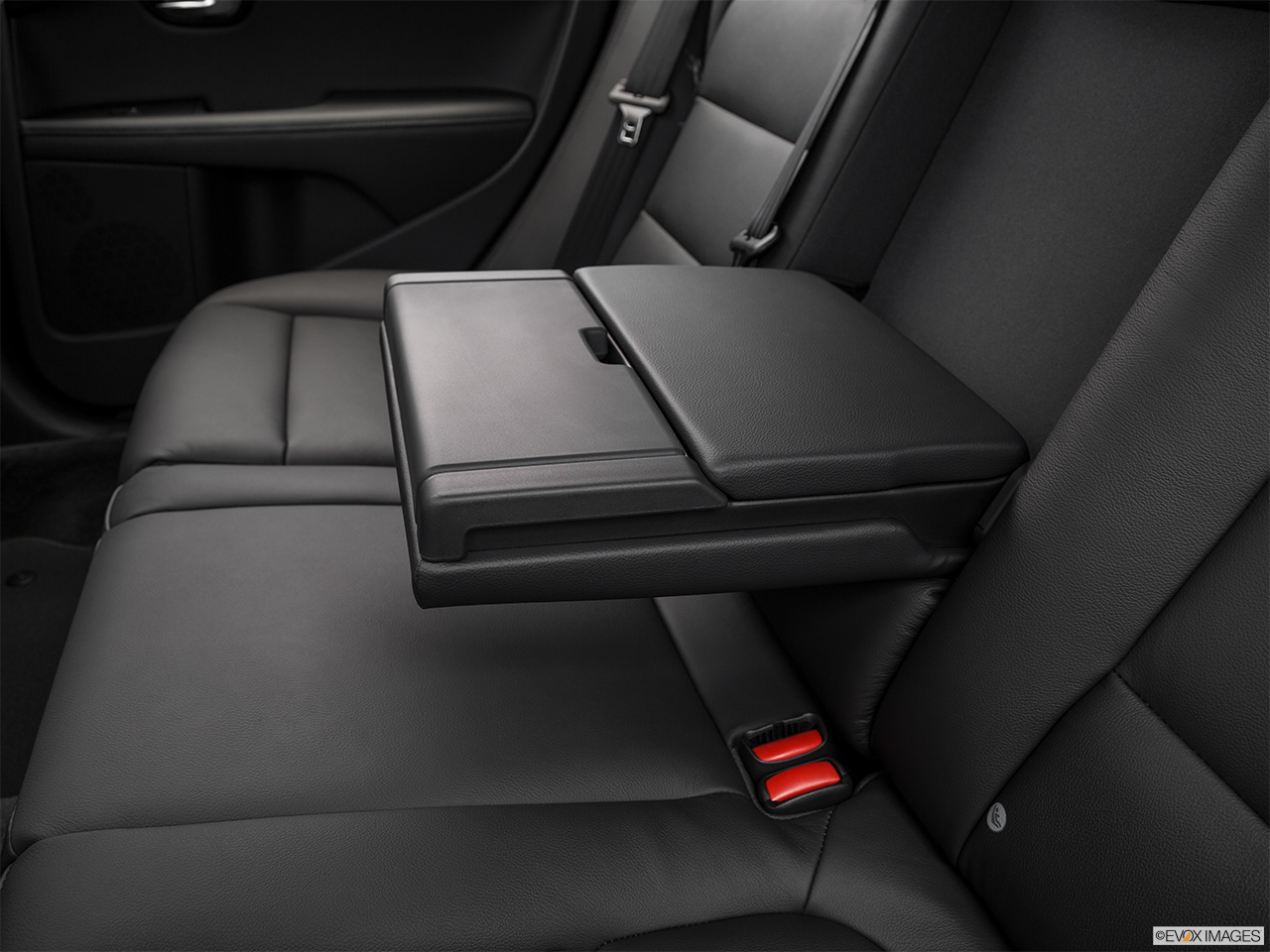 2016 Volvo XC70 T5 AWD Premier Rear center console with closed lid from driver's side looking down. 