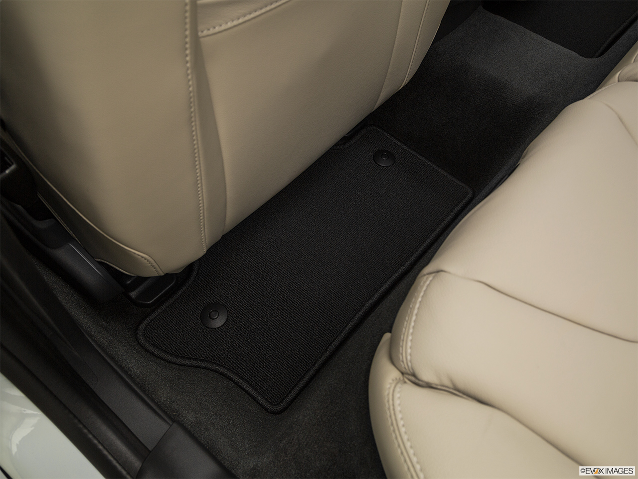 2017 Volvo V60 T5 Premier Rear driver's side floor mat. Mid-seat level from outside looking in. 