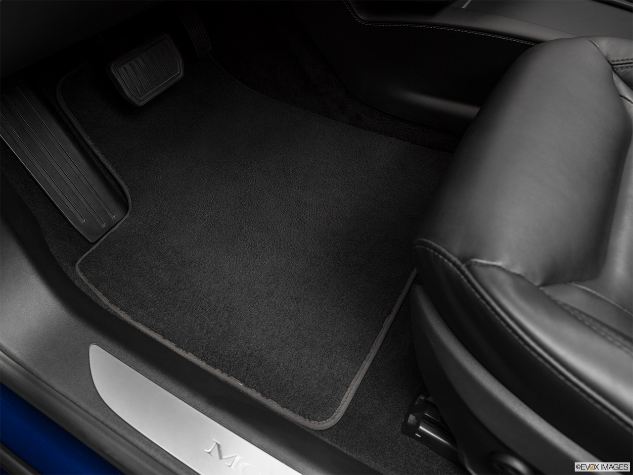 2016 Tesla Model S 75 Driver's floor mat and pedals. Mid-seat level from outside looking in. 