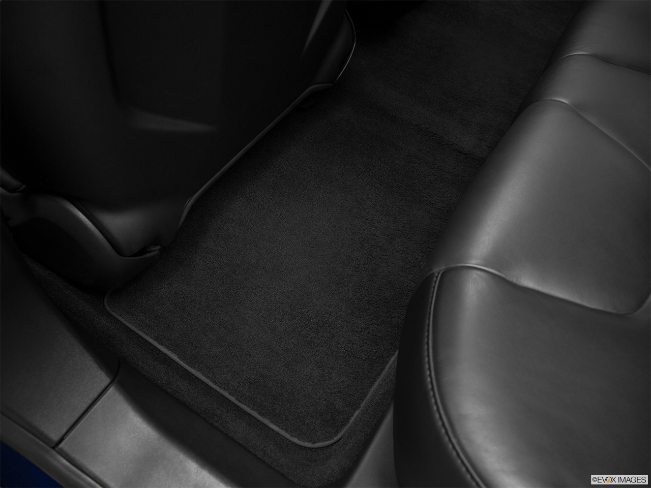 2016 Tesla Model S 75 Rear driver's side floor mat. Mid-seat level from outside looking in. 
