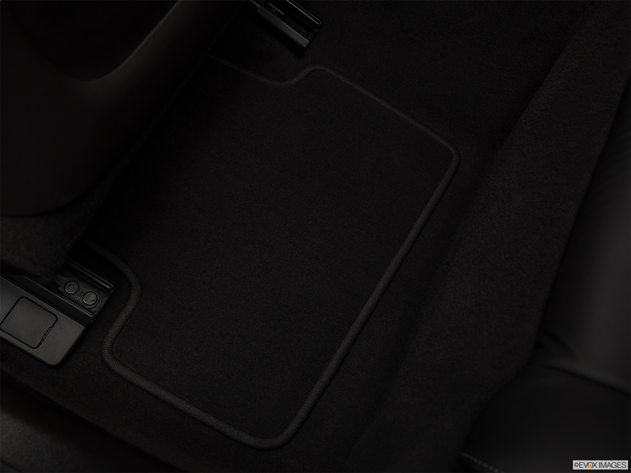 2019 Cadillac ATS Luxury Rear driver's side floor mat. Mid-seat level from outside looking in. 