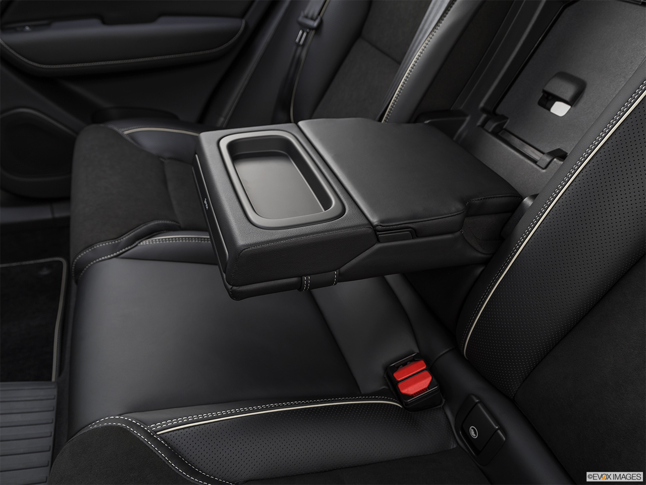 2019 Volvo XC60 T8 R-Design eAWD Plug-in Hybrid Rear center console with closed lid from driver's side looking down. 
