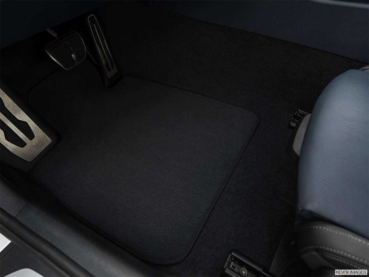 2019 BMW 8-series M850i xDrive Driver's floor mat and pedals. Mid-seat level from outside looking in. 