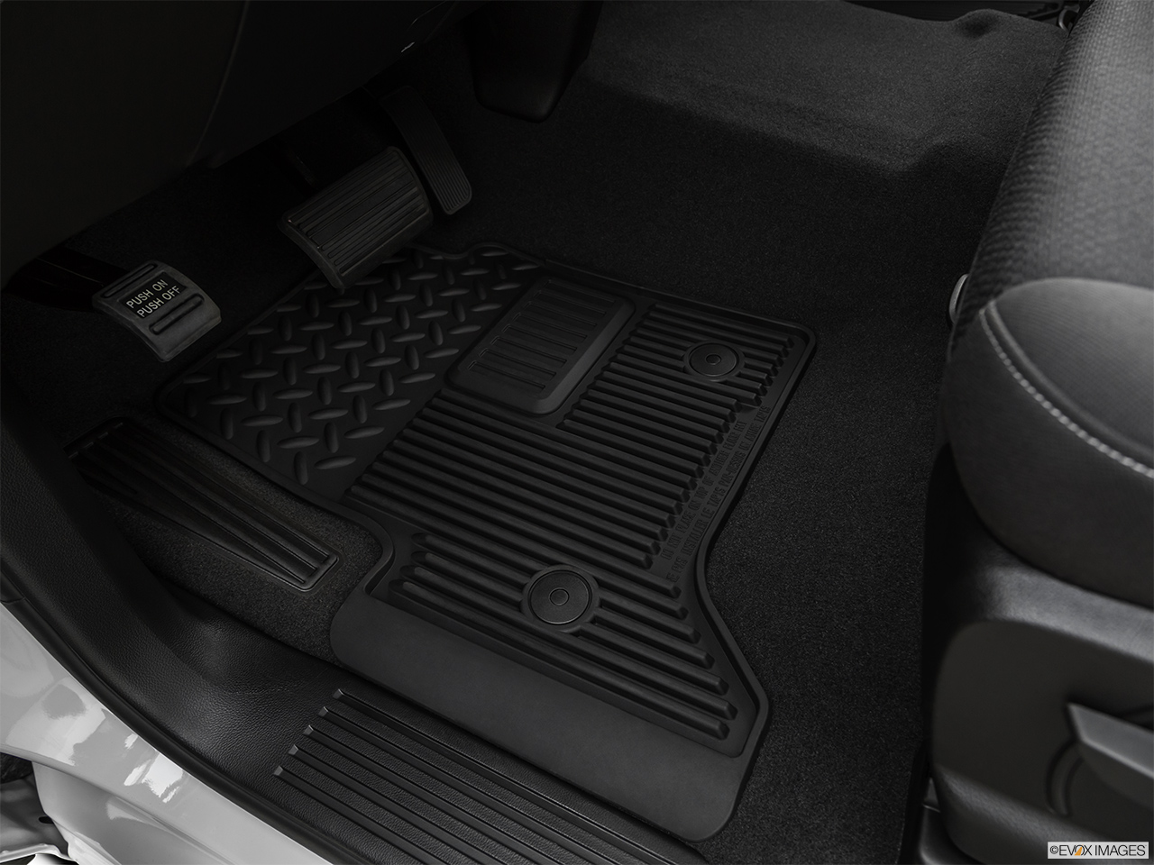 2019 GMC Sierra 2500HD SLE Driver's floor mat and pedals. Mid-seat level from outside looking in. 