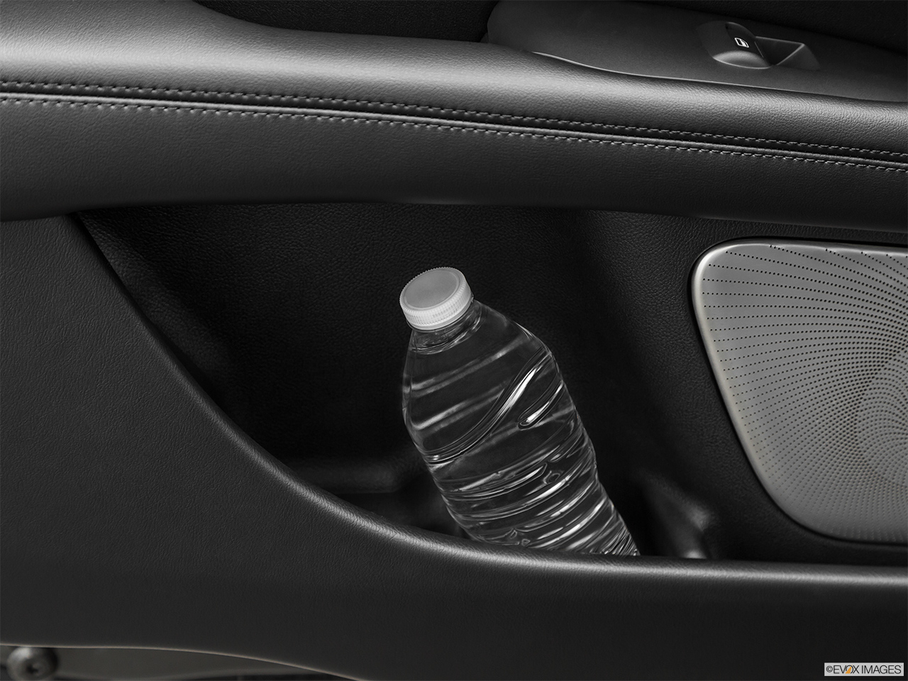 2020 Lincoln MKZ Reserve Second row side cup holder with coffee prop, or second row door cup holder with water bottle. 
