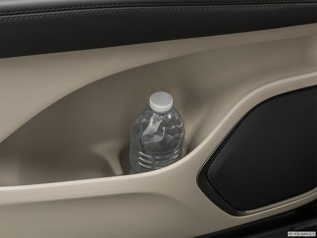 2020 Lincoln Nautilus Reserve Second row side cup holder with coffee prop, or second row door cup holder with water bottle. 