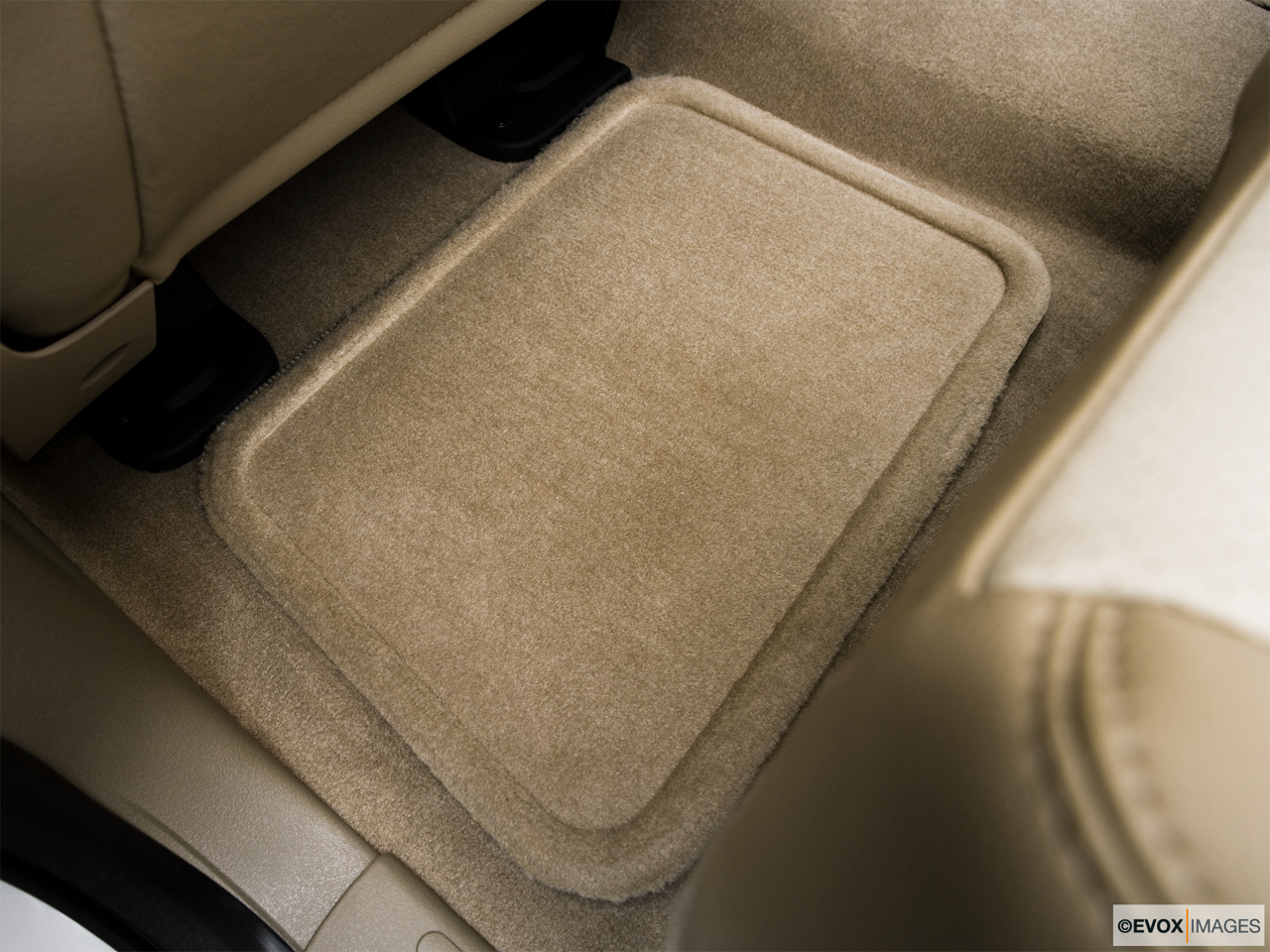 2010 Mercury Mountaineer Premier Rear driver's side floor mat. Mid-seat level from outside looking in. 