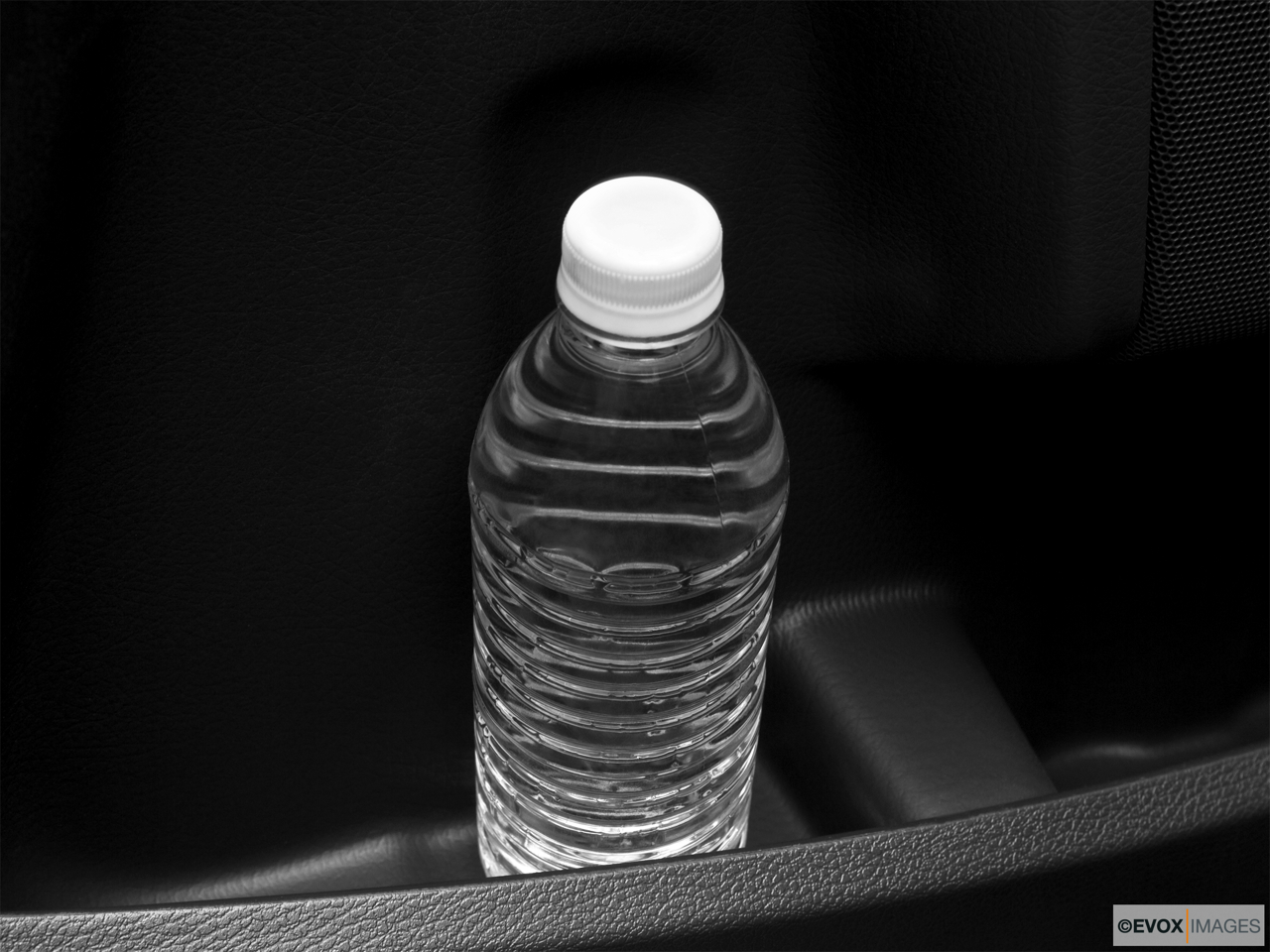 2010 Volvo XC90 3.2 Second row side cup holder with coffee prop, or second row door cup holder with water bottle. 