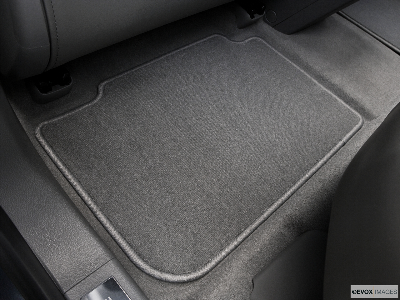 2010 Cadillac SRX Crossover Premium Collection Rear driver's side floor mat. Mid-seat level from outside looking in. 