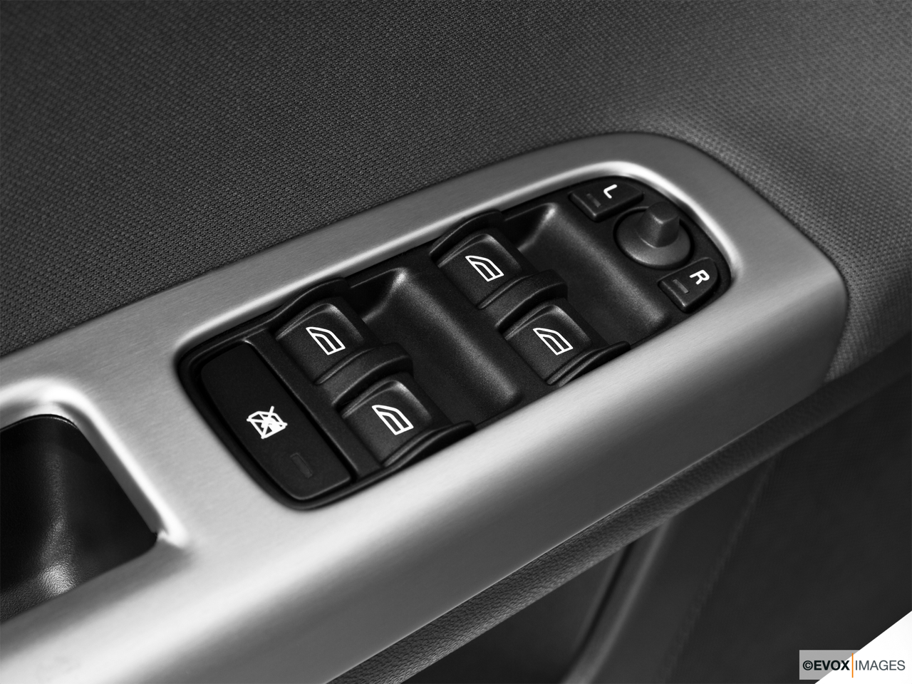 2010 Volvo V50 2.4I Driver's side inside window controls. 