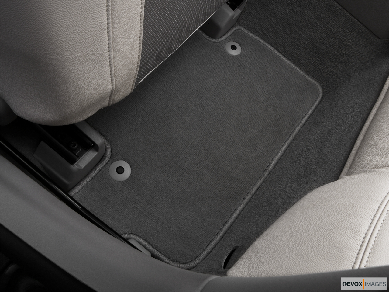 2010 Volvo C70 T5 A CV Rear driver's side floor mat. Mid-seat level from outside looking in. 