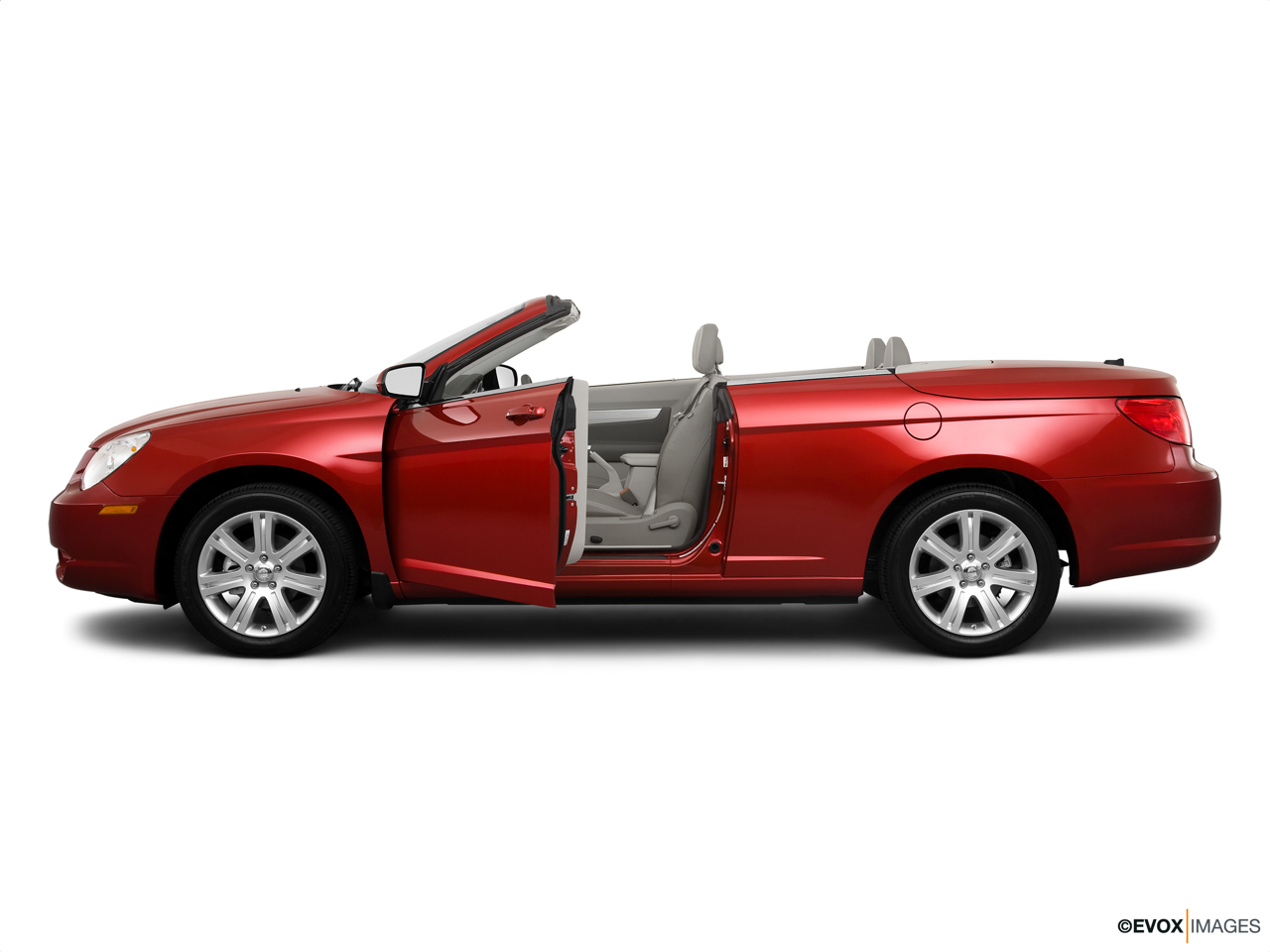 2010 Chrysler Sebring Touring Driver's side profile with drivers side door open. 