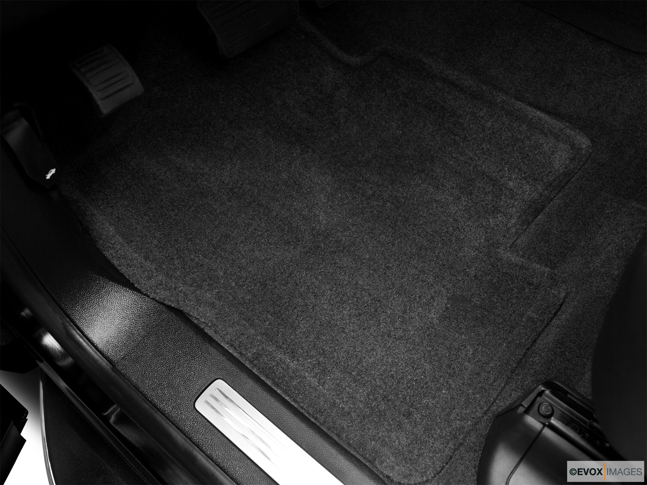 2010 Cadillac Escalade Hybrid Base Driver's floor mat and pedals. Mid-seat level from outside looking in. 