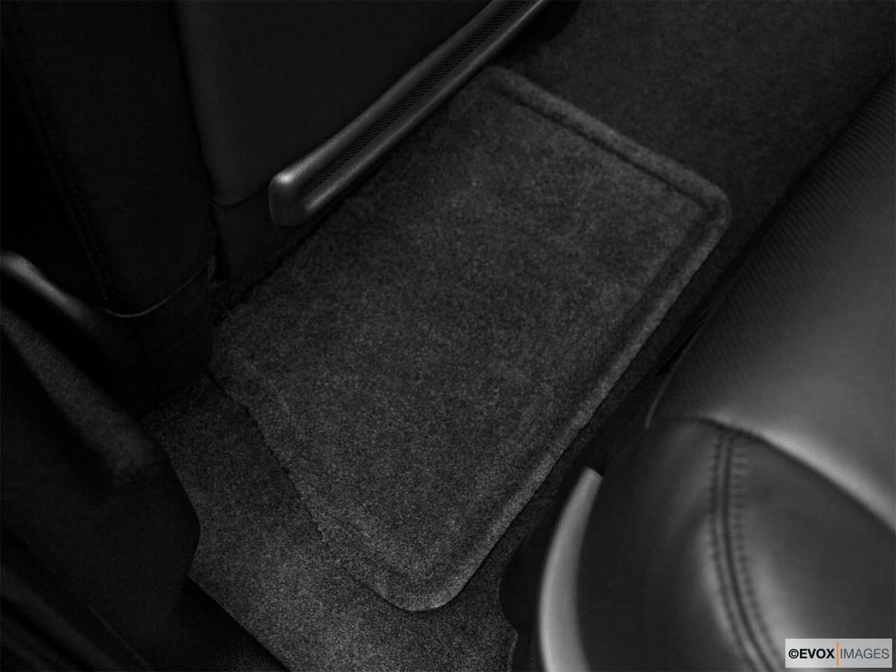 2010 Cadillac Escalade Hybrid Base Rear driver's side floor mat. Mid-seat level from outside looking in. 