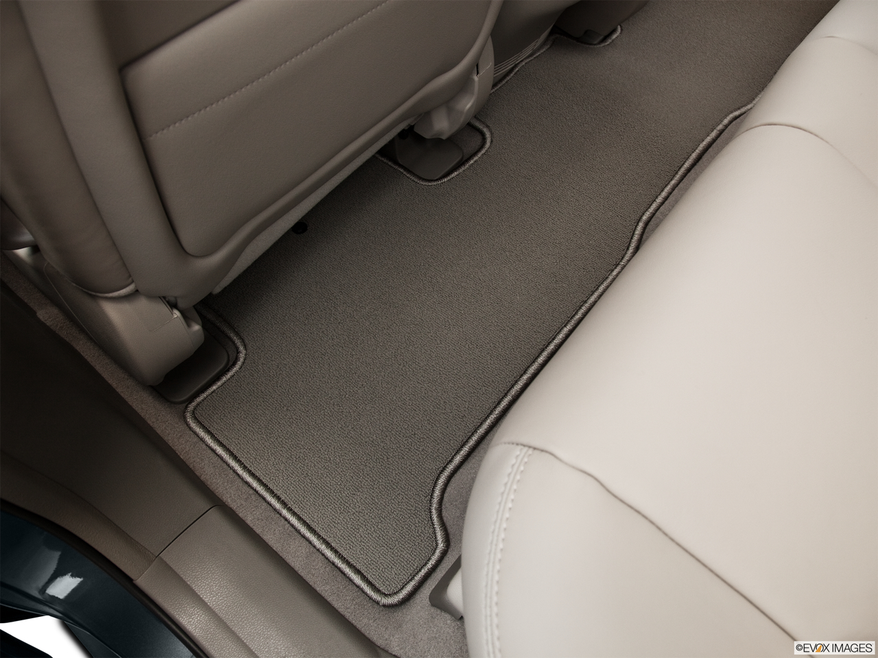 2011 Acura MDX Base Rear driver's side floor mat. Mid-seat level from outside looking in. 