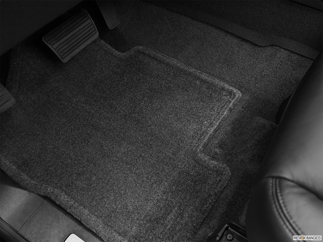 2012 Cadillac Escalade Hybrid Base Driver's floor mat and pedals. Mid-seat level from outside looking in. 