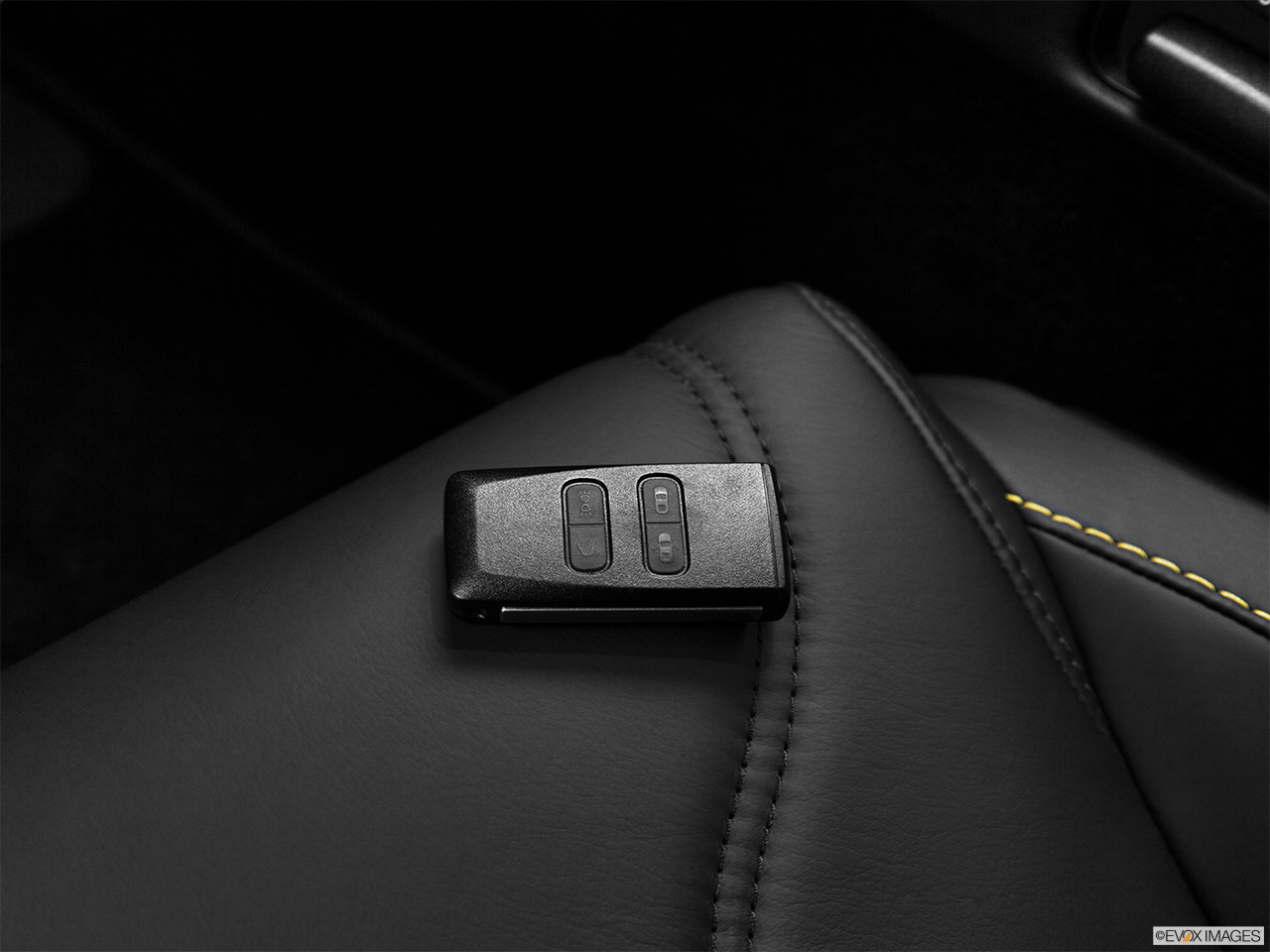 2012 Aston Martin V12 Vantage Base Key fob on driver's seat. 