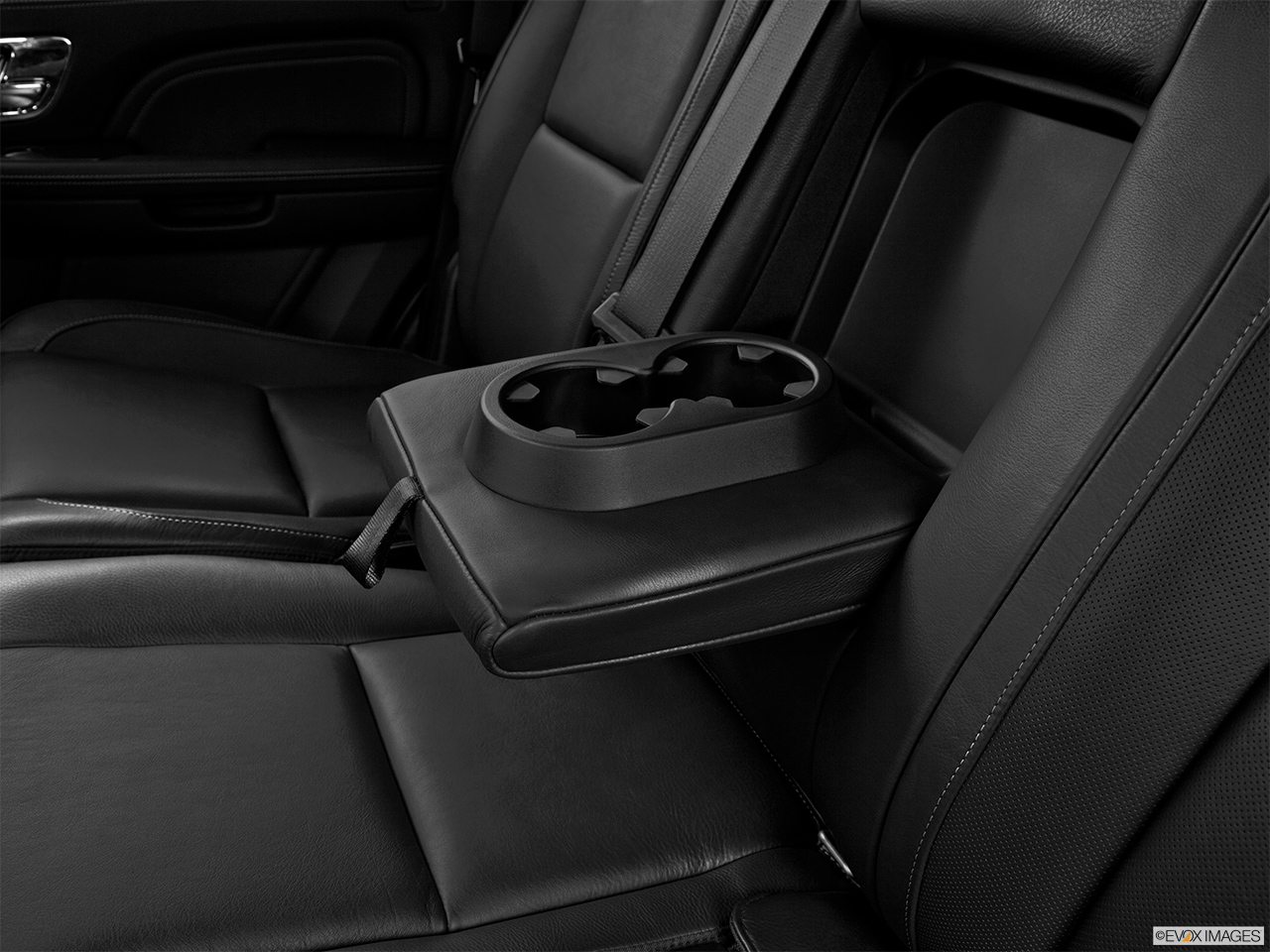 2013 Cadillac Escalade Hybrid Platinum Rear center console with closed lid from driver's side looking down. 