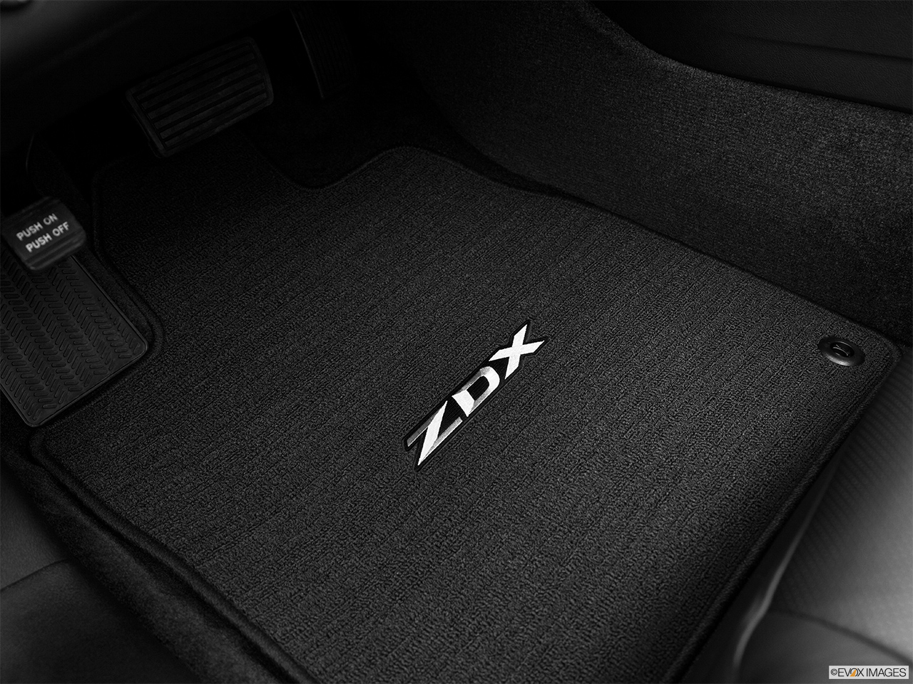 2013 Acura ZDX Base Driver's floor mat and pedals. Mid-seat level from outside looking in. 