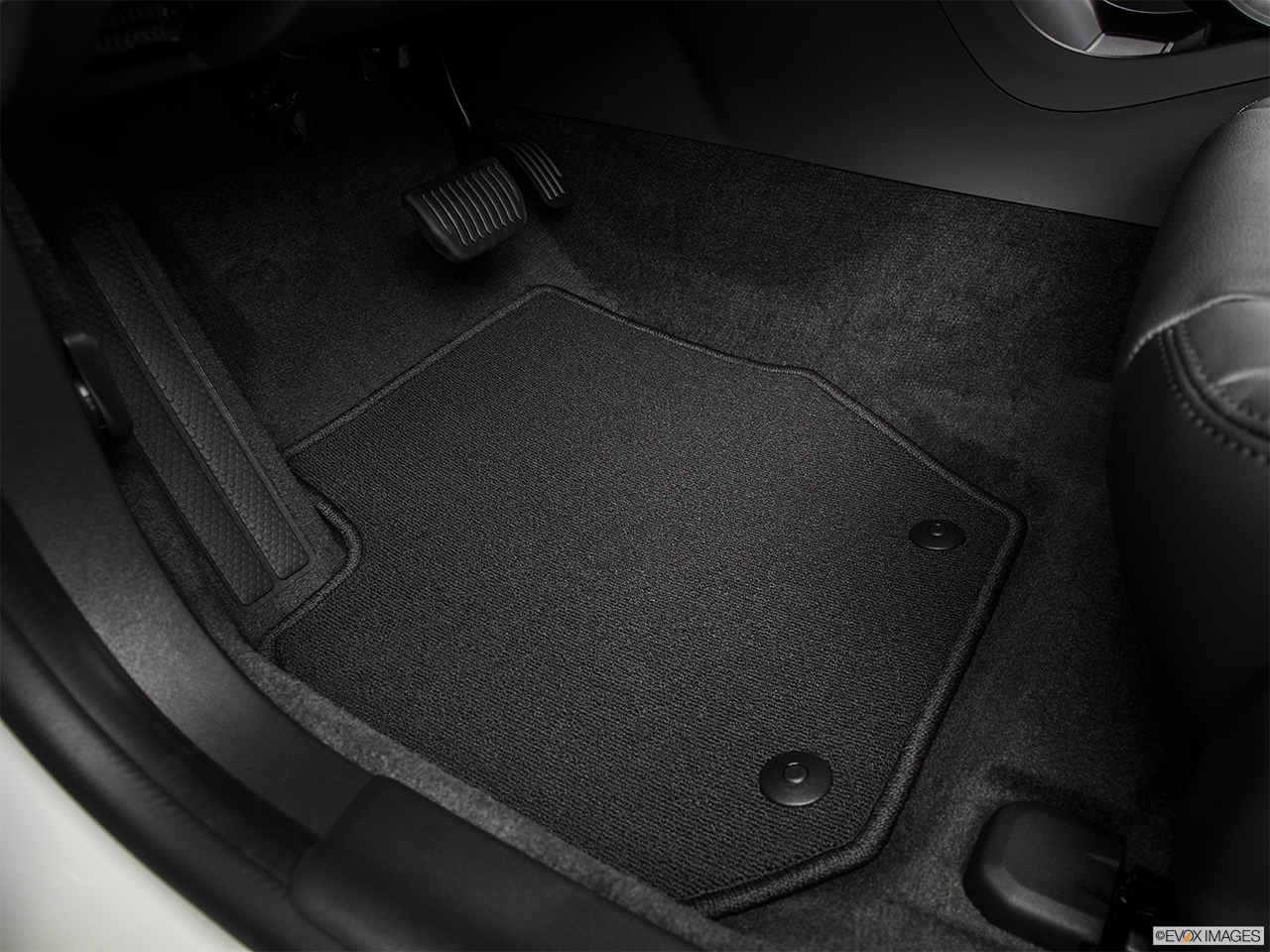 2015 Volvo V60 Premier Plus Driver's floor mat and pedals. Mid-seat level from outside looking in. 