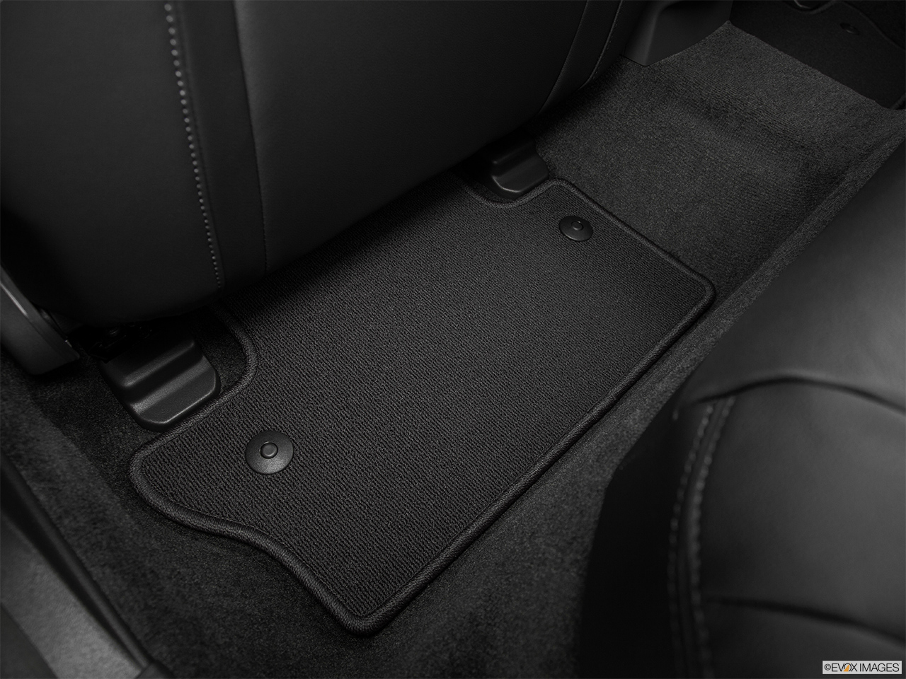 2015 Volvo V60 Premier Plus Rear driver's side floor mat. Mid-seat level from outside looking in. 