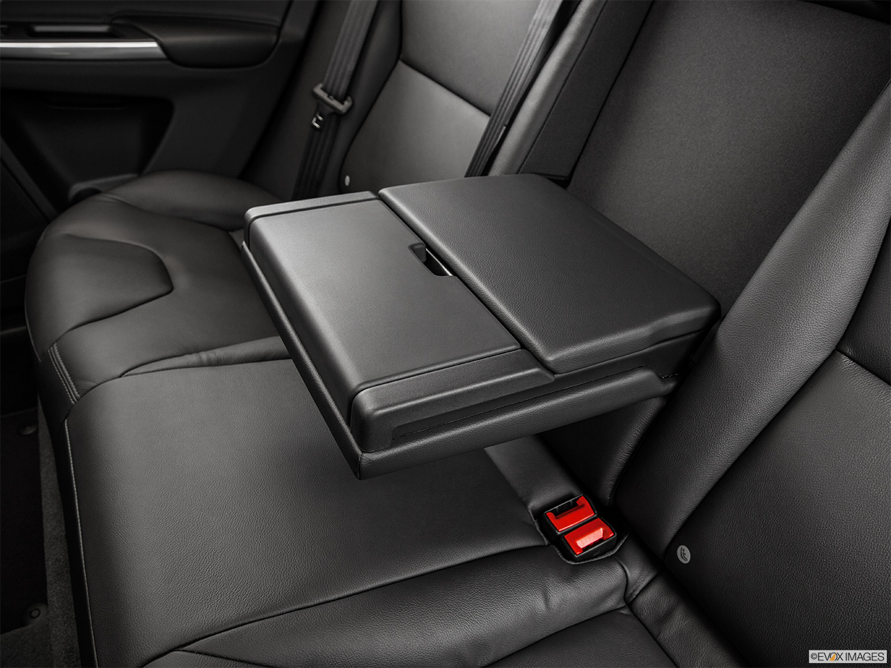 2015 Volvo XC60 Premier Rear center console with closed lid from driver's side looking down. 