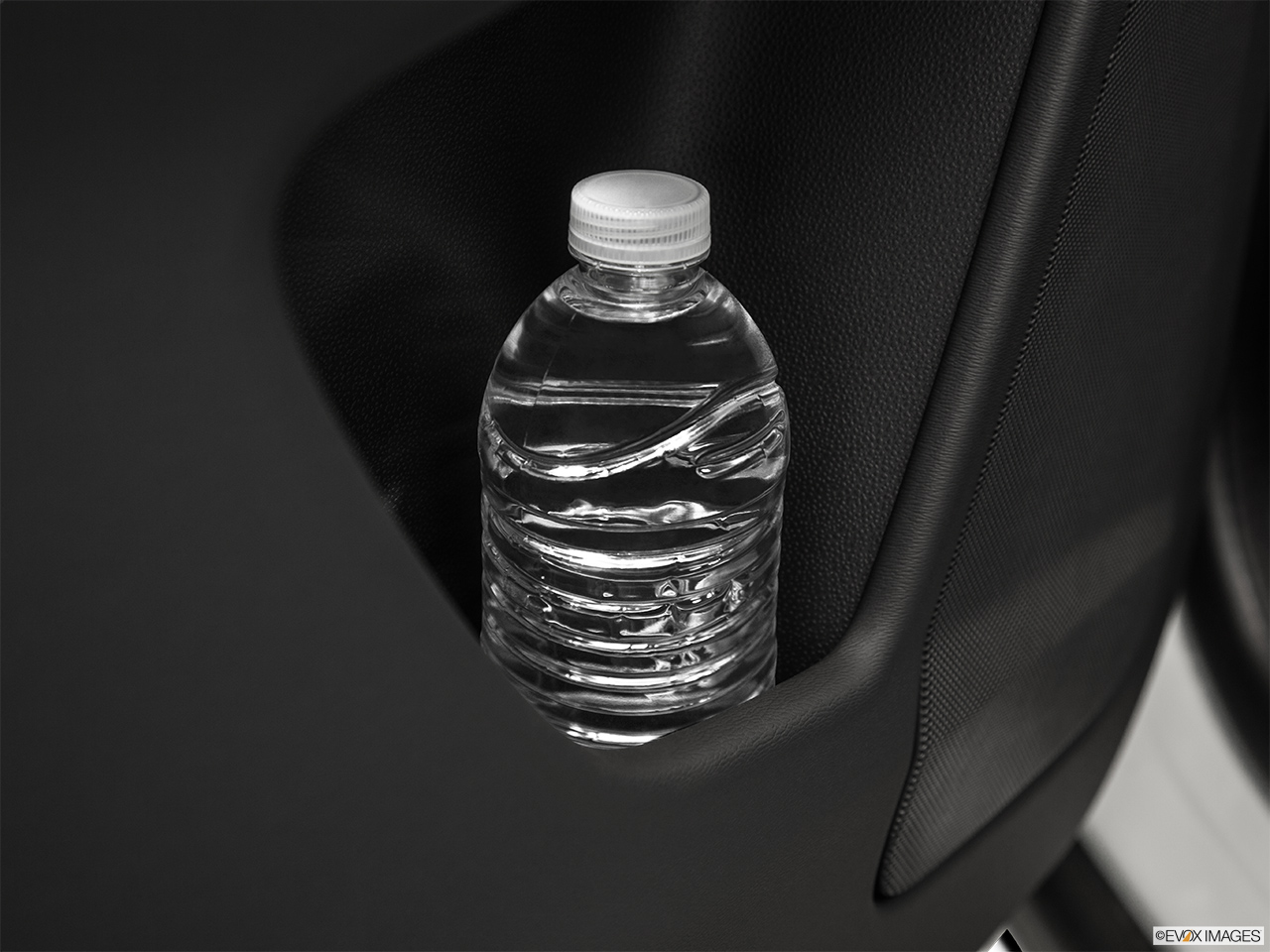 2015 Volvo XC60 Premier Second row side cup holder with coffee prop, or second row door cup holder with water bottle. 