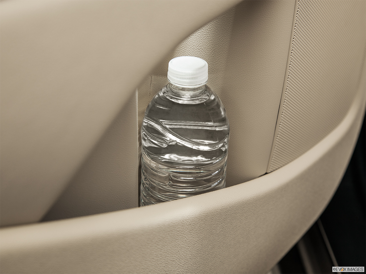 2015 Volvo XC70 Premier Plus Second row side cup holder with coffee prop, or second row door cup holder with water bottle. 