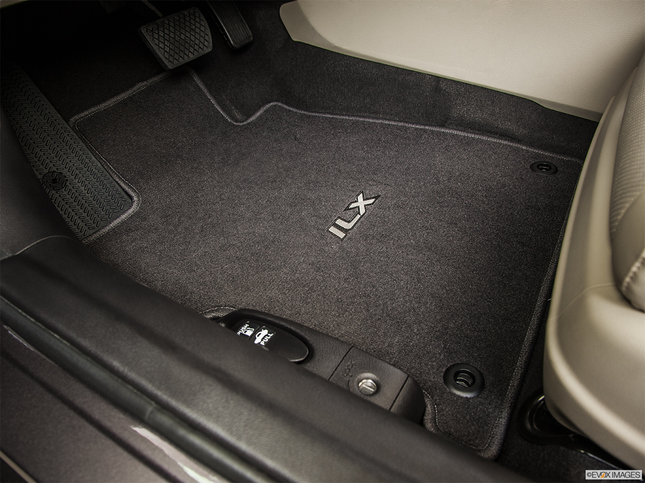 2014 Acura ILX Hybrid Base Driver's floor mat and pedals. Mid-seat level from outside looking in. 