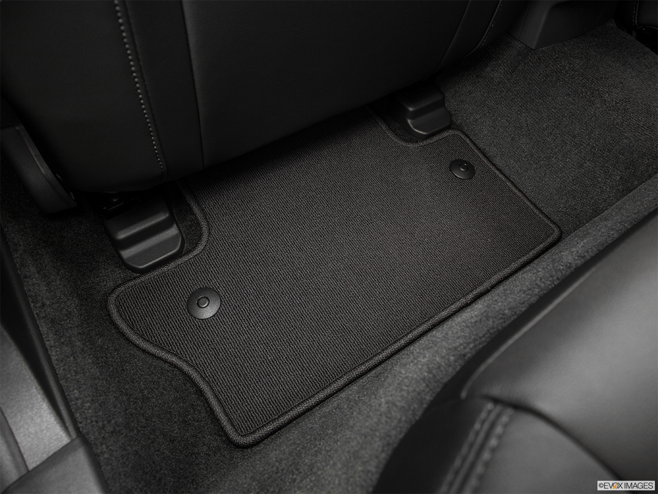 2015 Volvo S60 Premier Rear driver's side floor mat. Mid-seat level from outside looking in. 