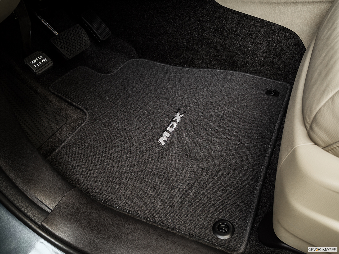 2016 Acura MDX Base Driver's floor mat and pedals. Mid-seat level from outside looking in. 